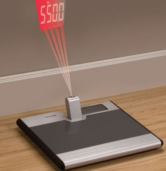 Pound Projection Scale - Uma balança que projeta o peso na parede.