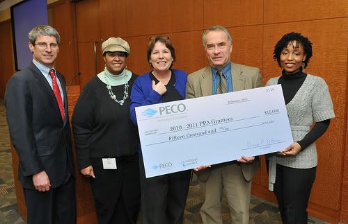 Kim Tucker and Suzanne Cloud Accepting Check